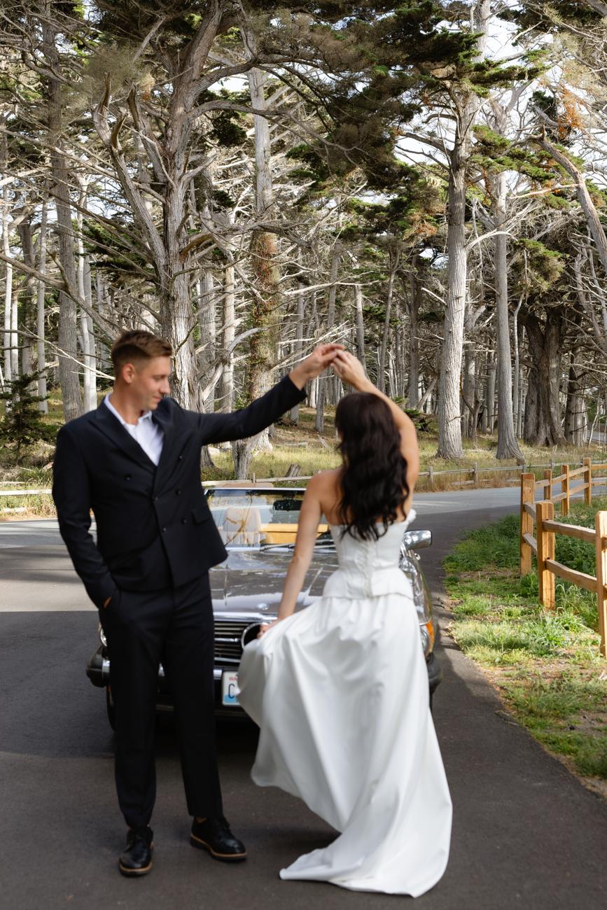 Dancing beside the Mercedes under the cypress trees